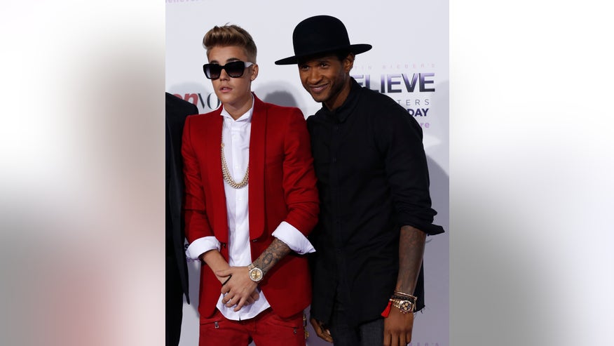 justin bieber and usher pose reuters.jpg